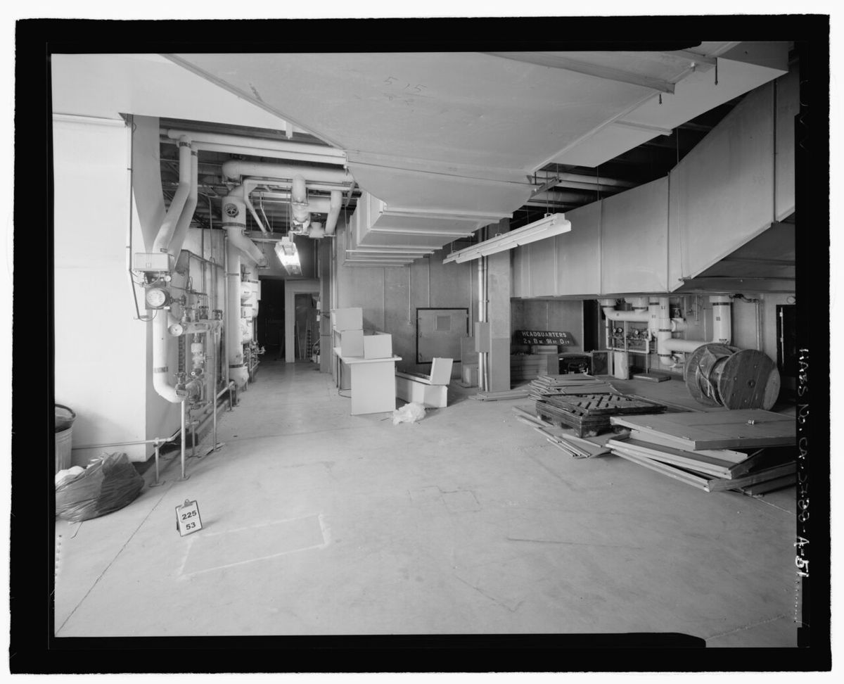 Basement utility area with sump pump and water equipment