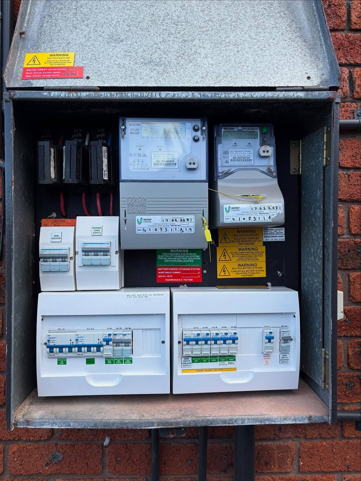 Two wall-mounted home battery units installed indoors