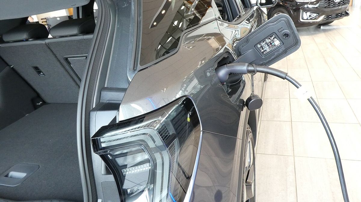 EV charging cable plugged into an electric car