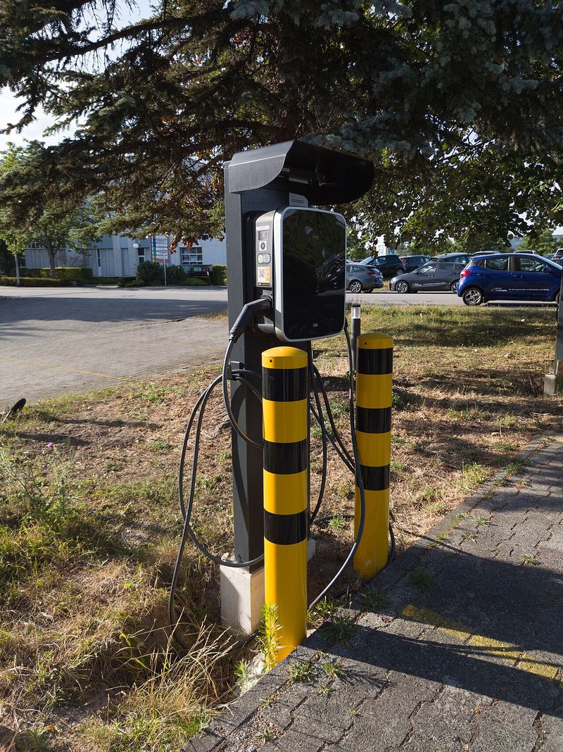 Close-up of two charging handles on a ChargePoint EV charging station