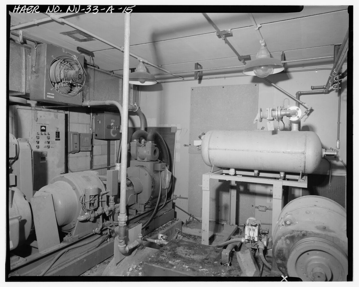 Technician testing a standby generator