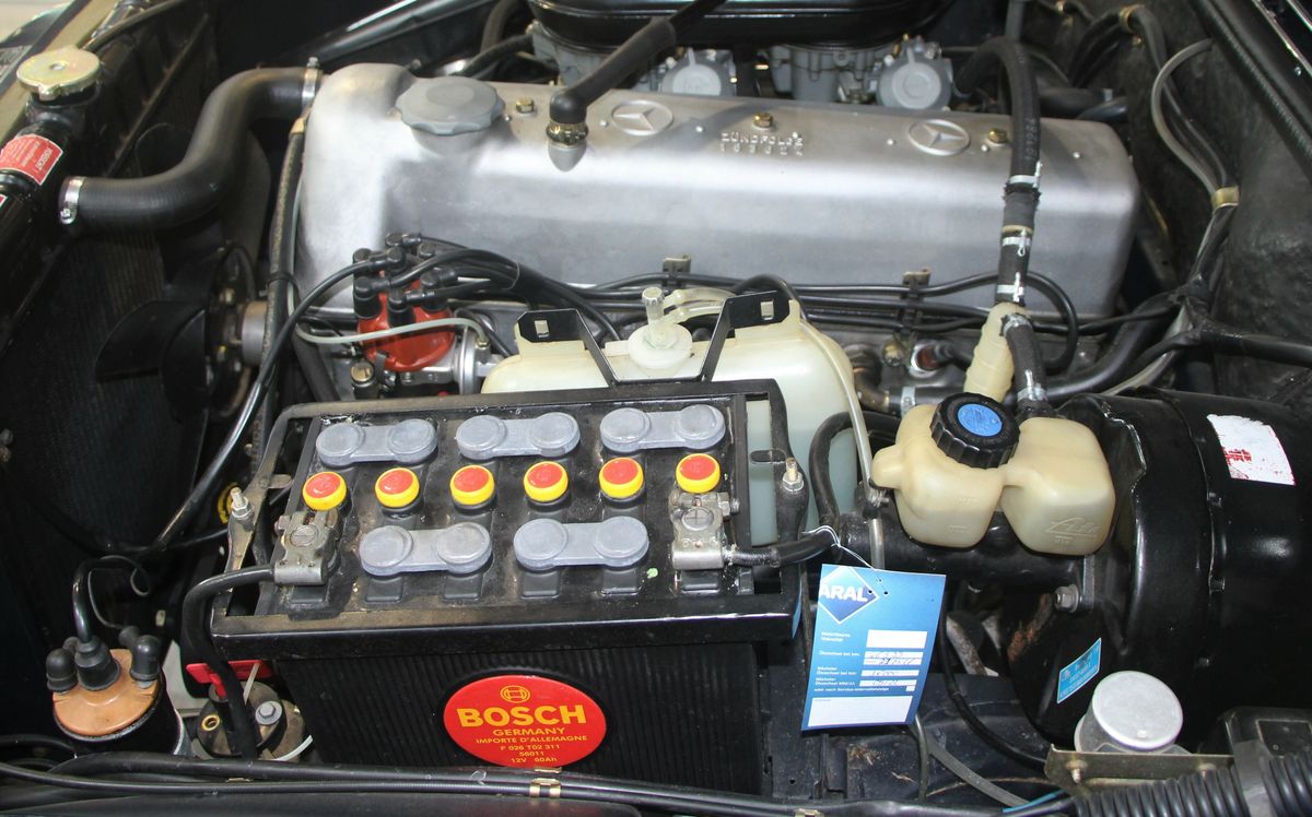 A Bosch starter battery installed in an engine bay