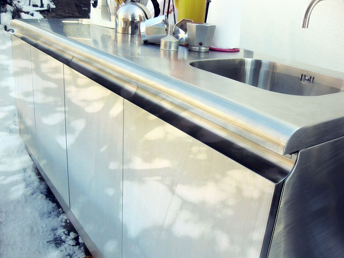 Premium stainless steel built-in outdoor kitchen with sink and countertop