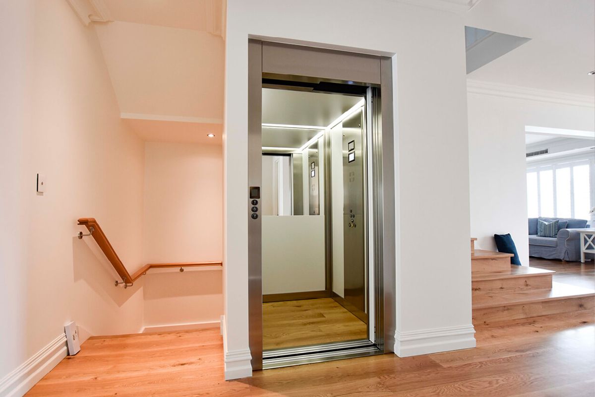 A glass home elevator installed inside a residential building