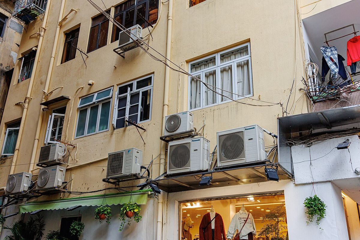 Outdoor AC condenser unit on a pad