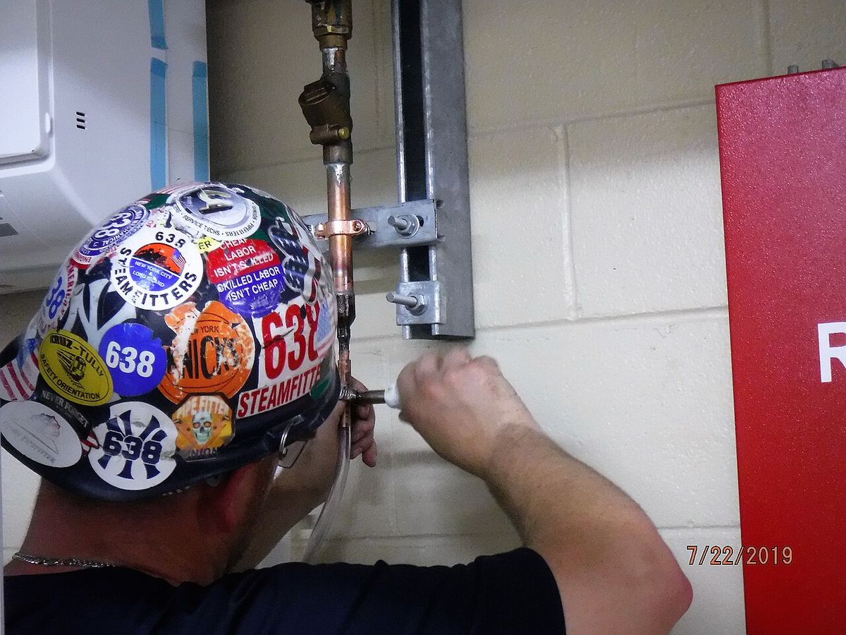 Copper refrigerant lines on an AC unit