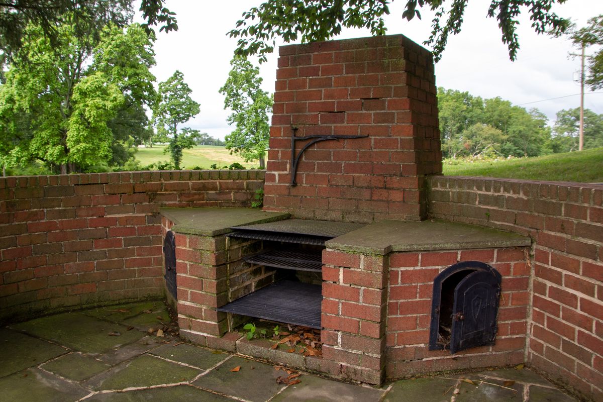 Brick outdoor barbecue grill structure at a home