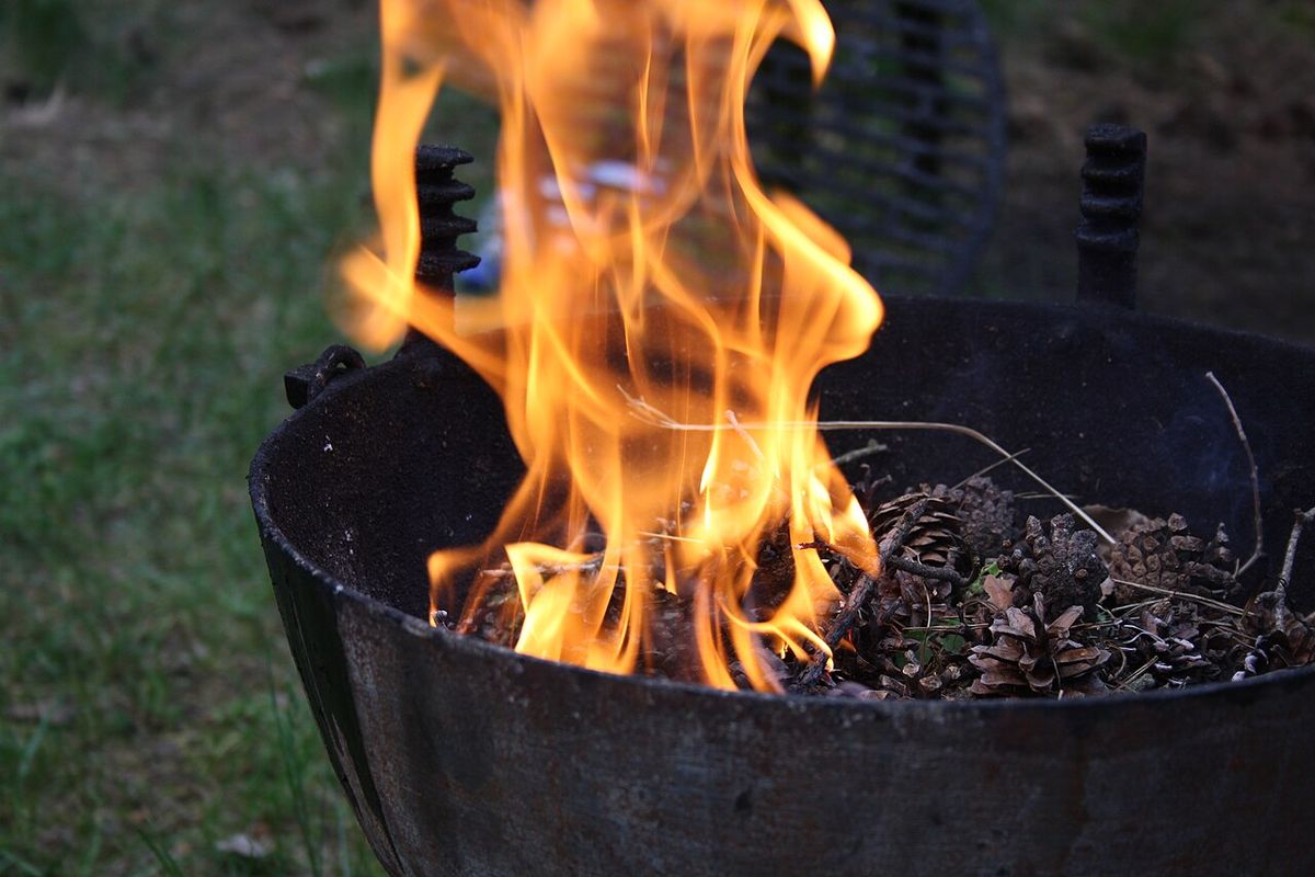Outdoor smoker grill in a backyard kitchen setup
