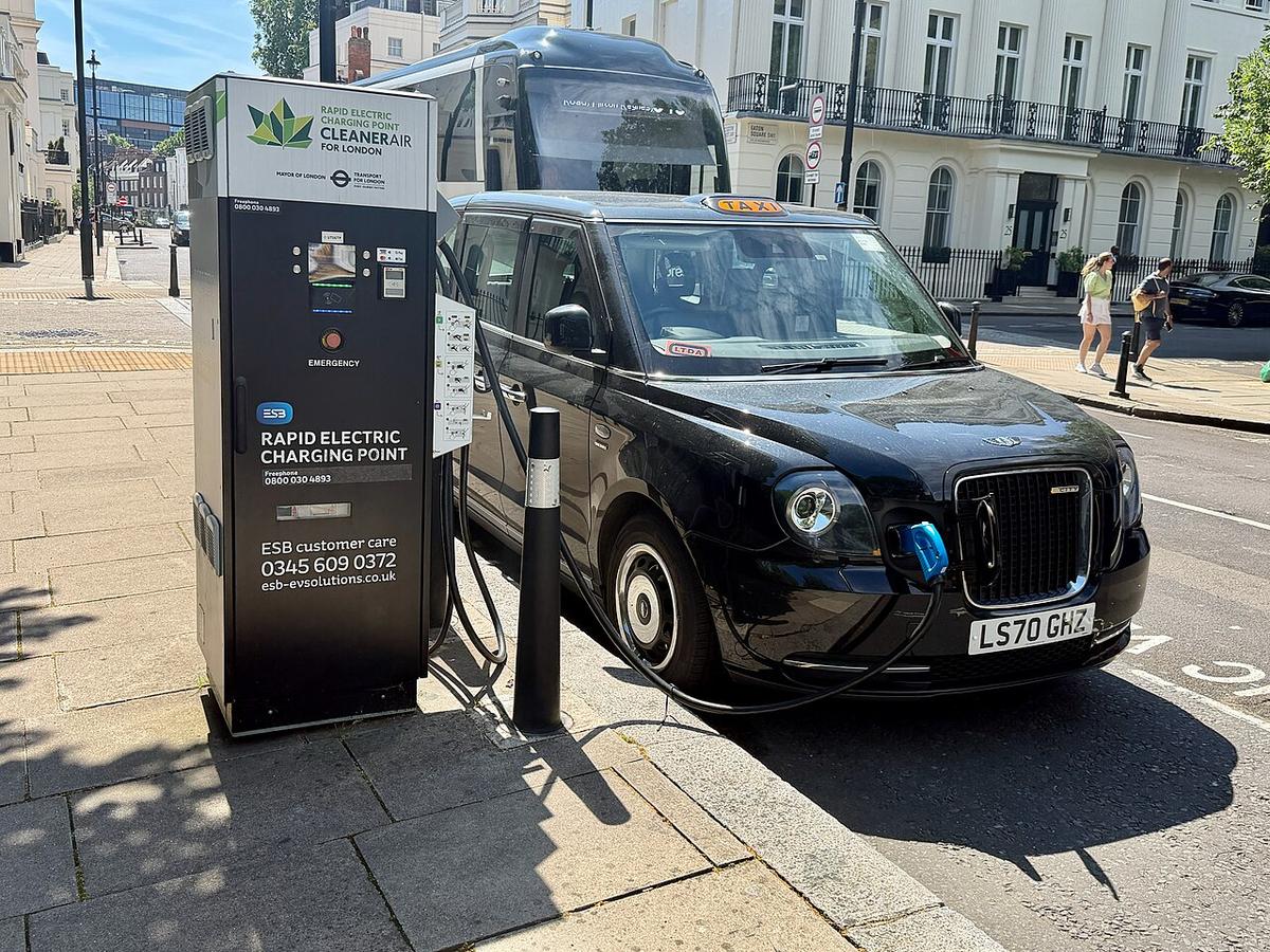 Home EV charging wallbox with a coiled charging cable