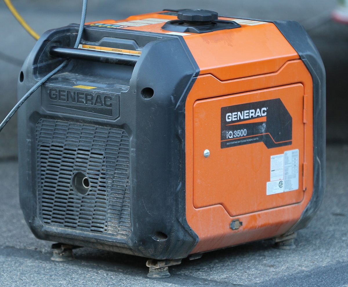 Close-up of an orange Generac iQ3500 inverter generator
