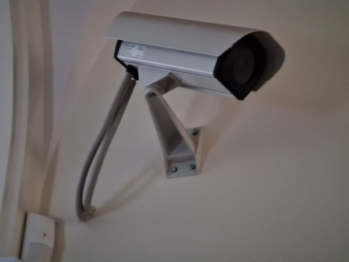 A security camera mounted on a wall for home monitoring