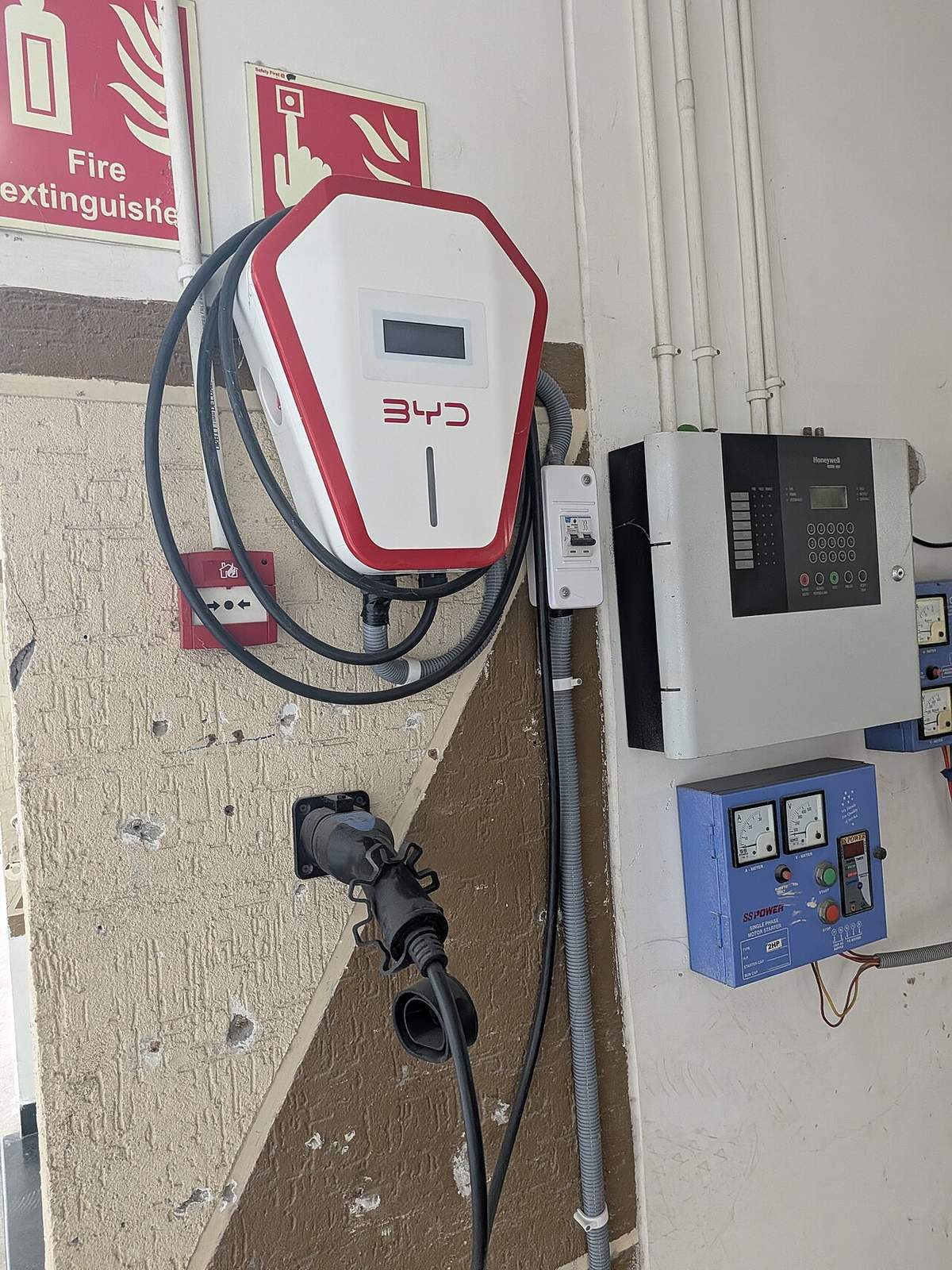 Electric car charging inside a garage