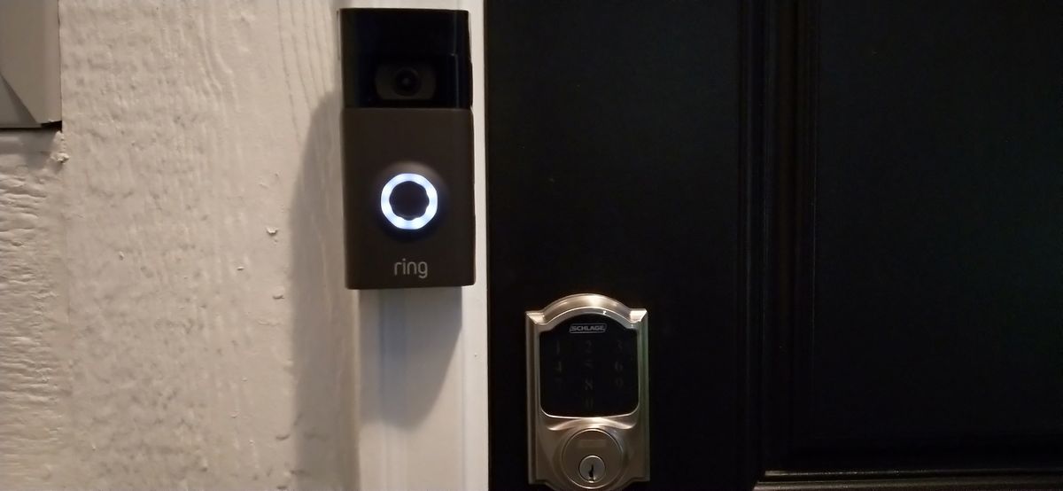 A smart doorbell camera and keypad smart lock installed on a home entry