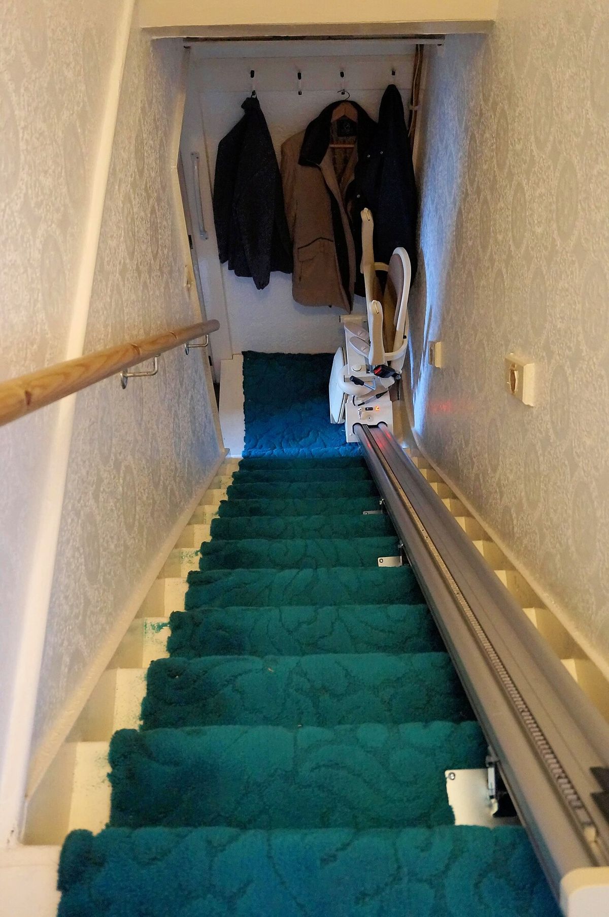 Stairlift installed along the staircase of a terraced house