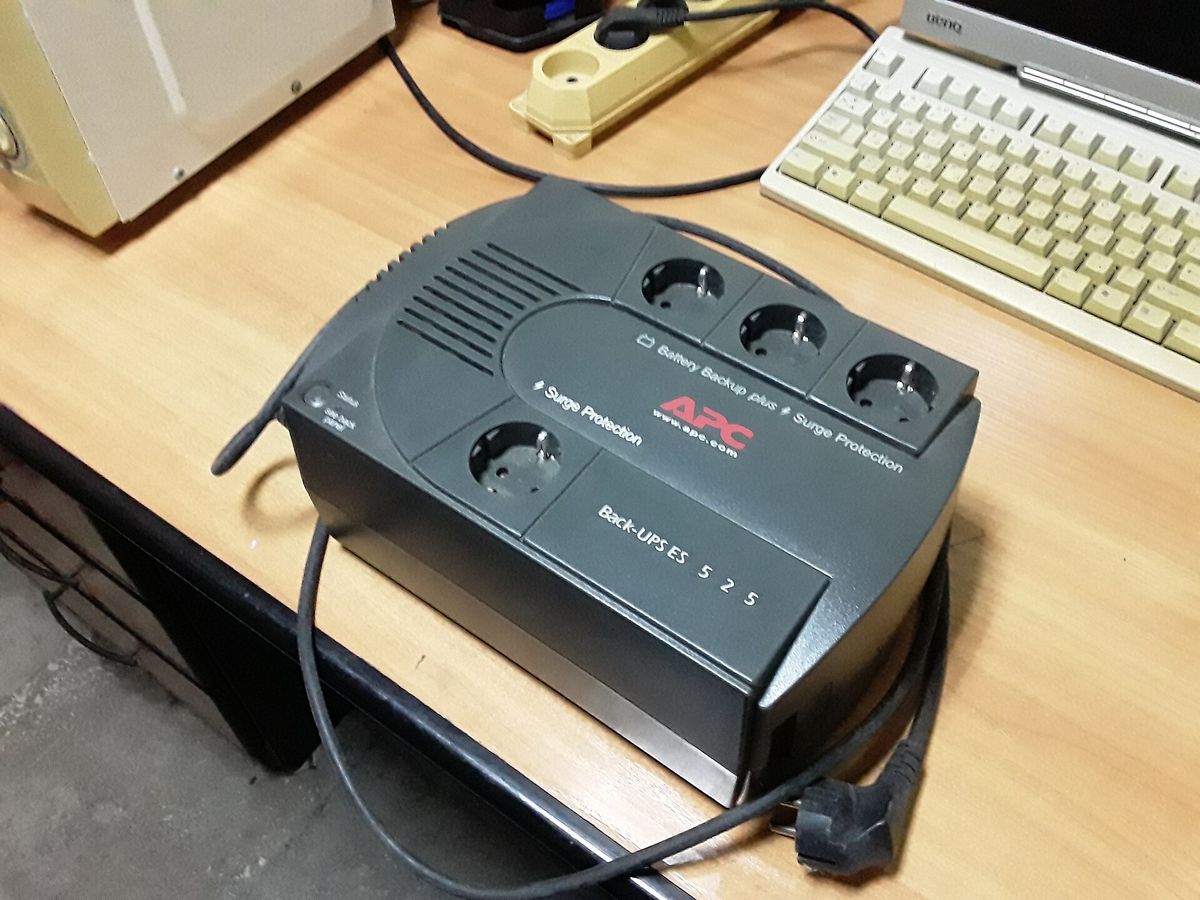 APC Back-UPS home uninterruptible power supply unit on a desk
