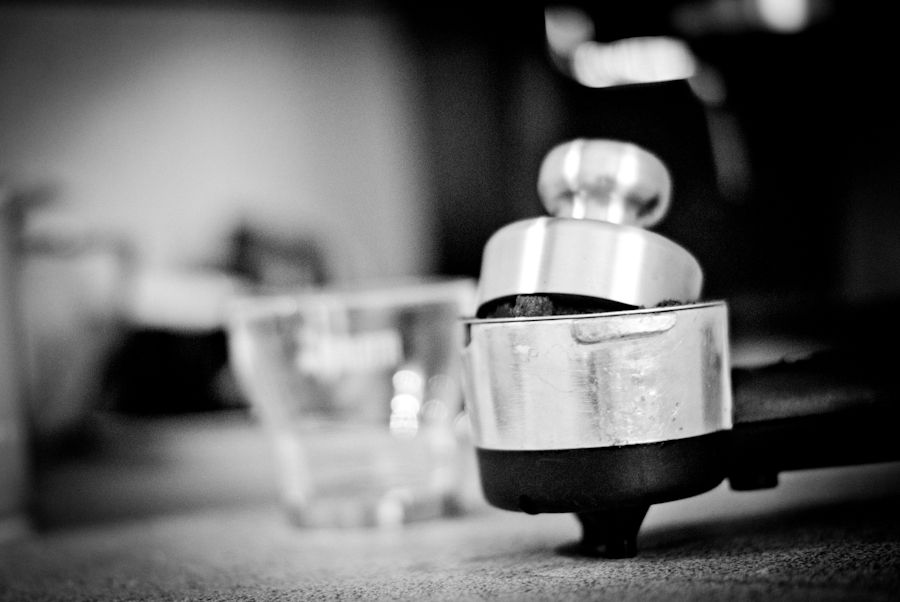 A portafilter and tamper from a home espresso machine