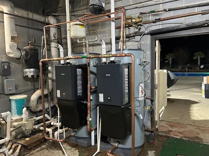 Expansion tank mounted above a water heater