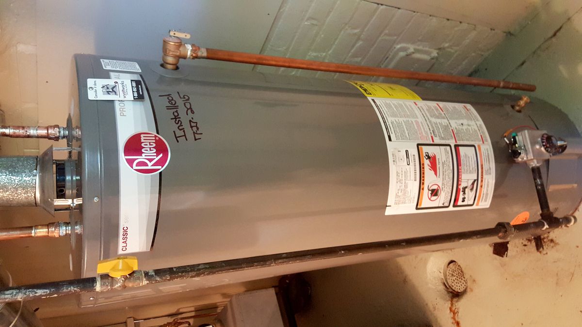 Gas water heater tank with connected copper piping