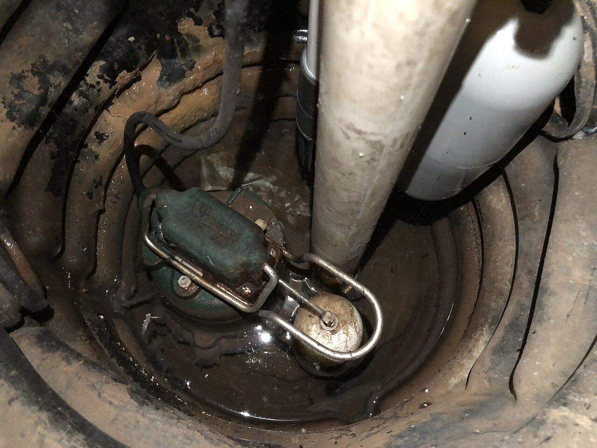 Newly installed sump pump in a residential basement